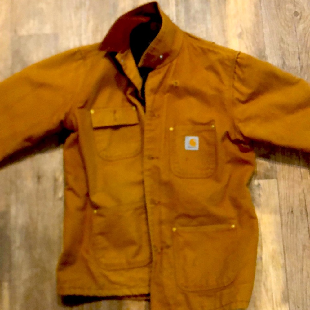 Carharrt wool lined coat has one small hole by shoulder but in like new shape